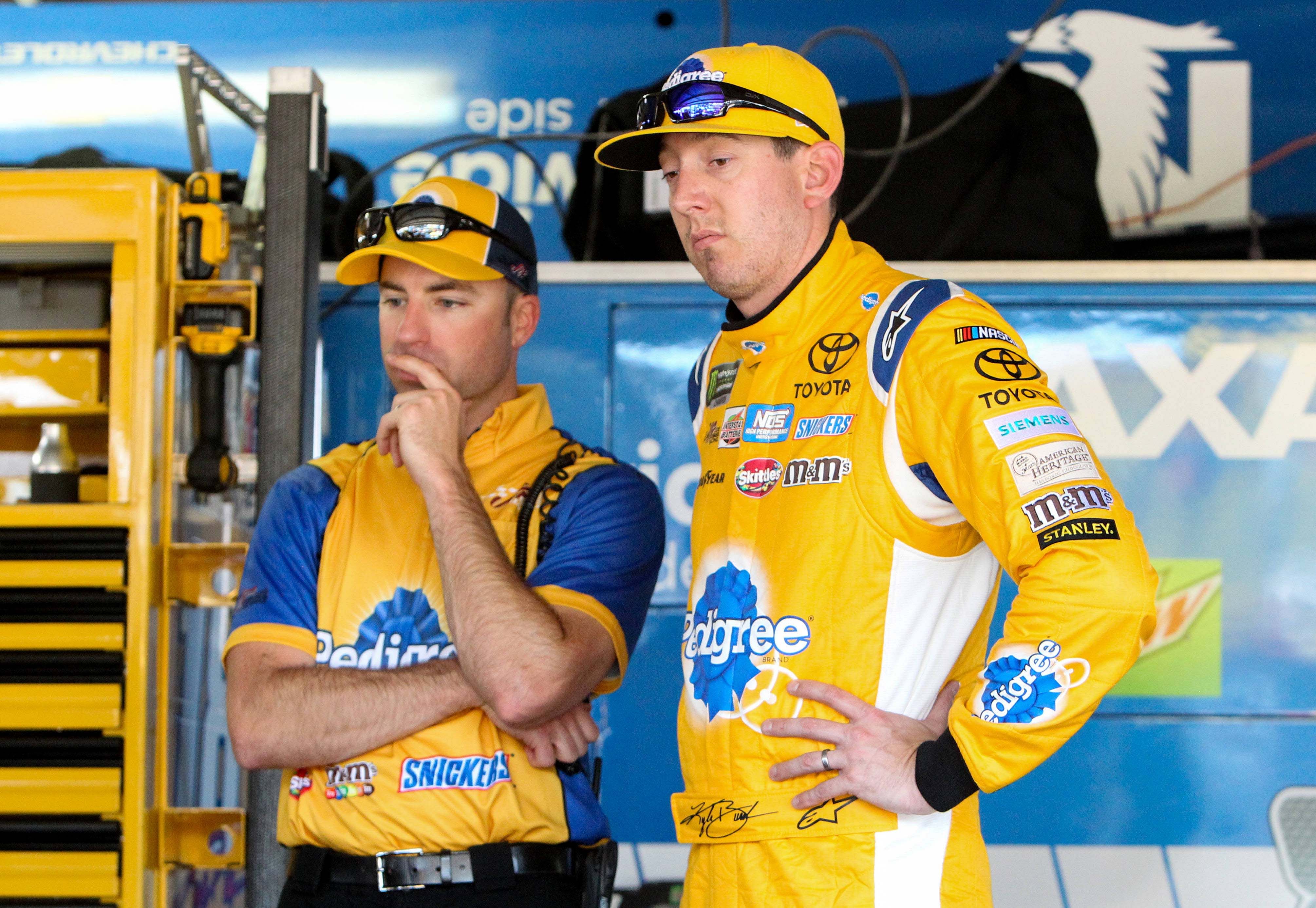 Kyle Busch (right) and crew chief Adam Stevens (left) stand in the garage during the practice for the AAA 400 Drive For Autism at Dover International Speedway, June 2nd 2017 - Source: Imagn